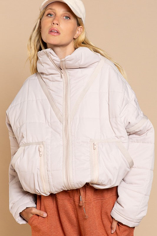 Designed in quilted jacket with zipper closure