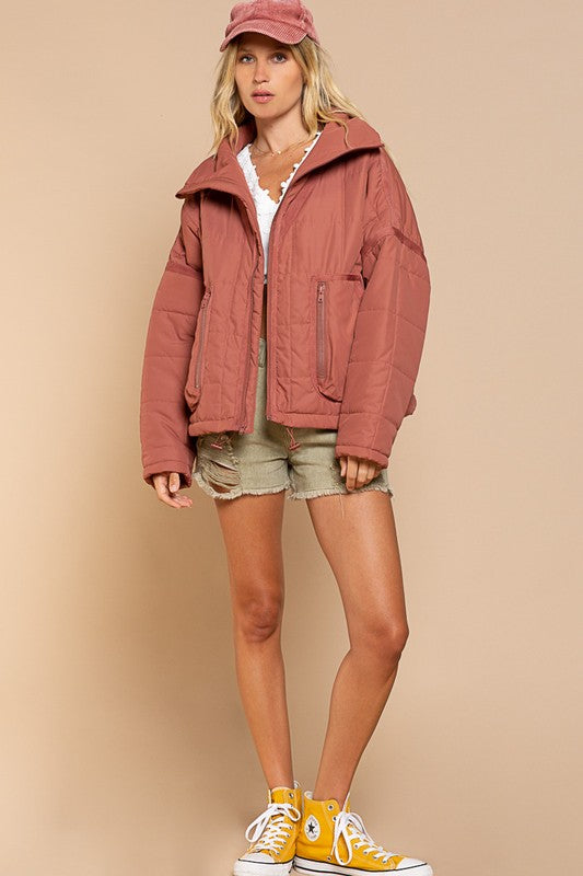 Designed in quilted jacket with zipper closure