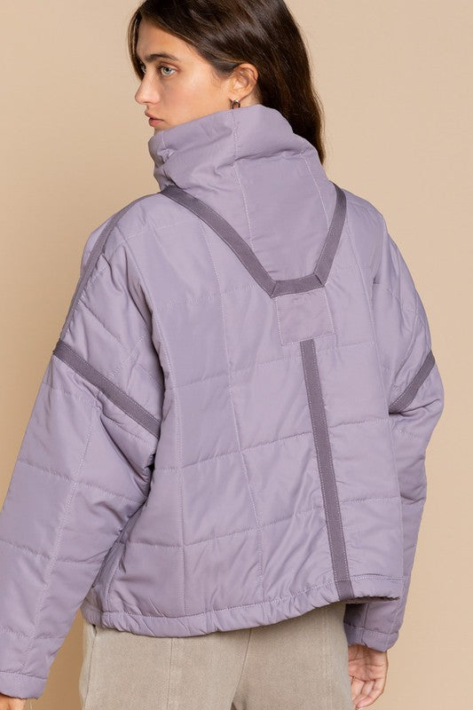 Designed in quilted jacket with zipper closure